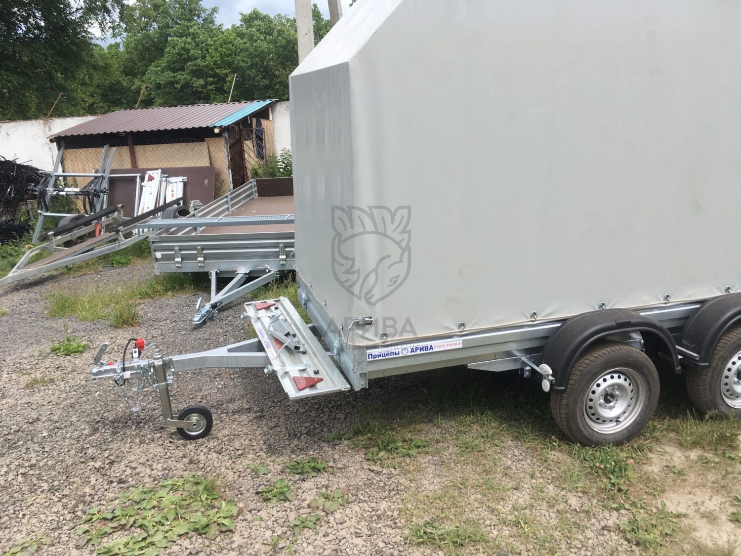 Двухосный прицеп МЗСА 817732.012 с заводским трапом и ЕВРО тентом